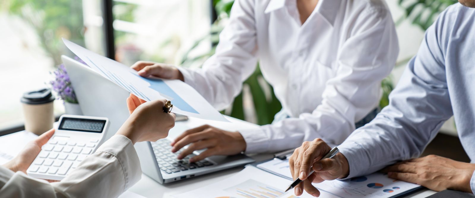 Payroll services team processing paychecks for a US small business